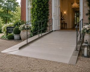 A ramped, step-free entrance with handrails leading up to a venue's main door.
